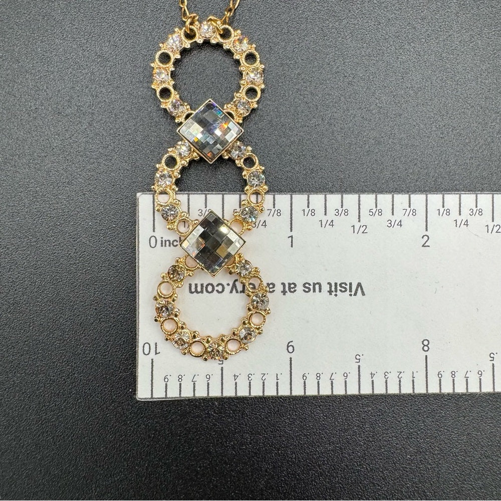 Vintage Belladonna Circular Crystal and Gold Tone Infinity Pendant Necklace