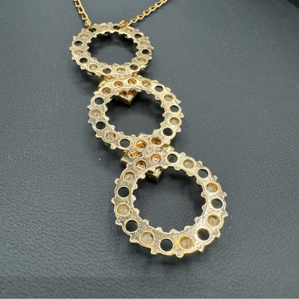 Vintage Belladonna Circular Crystal and Gold Tone Infinity Pendant Necklace
