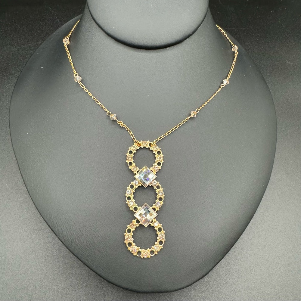Vintage Belladonna Circular Crystal and Gold Tone Infinity Pendant Necklace
