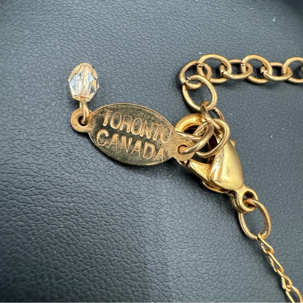 Vintage Belladonna Circular Crystal and Gold Tone Infinity Pendant Necklace