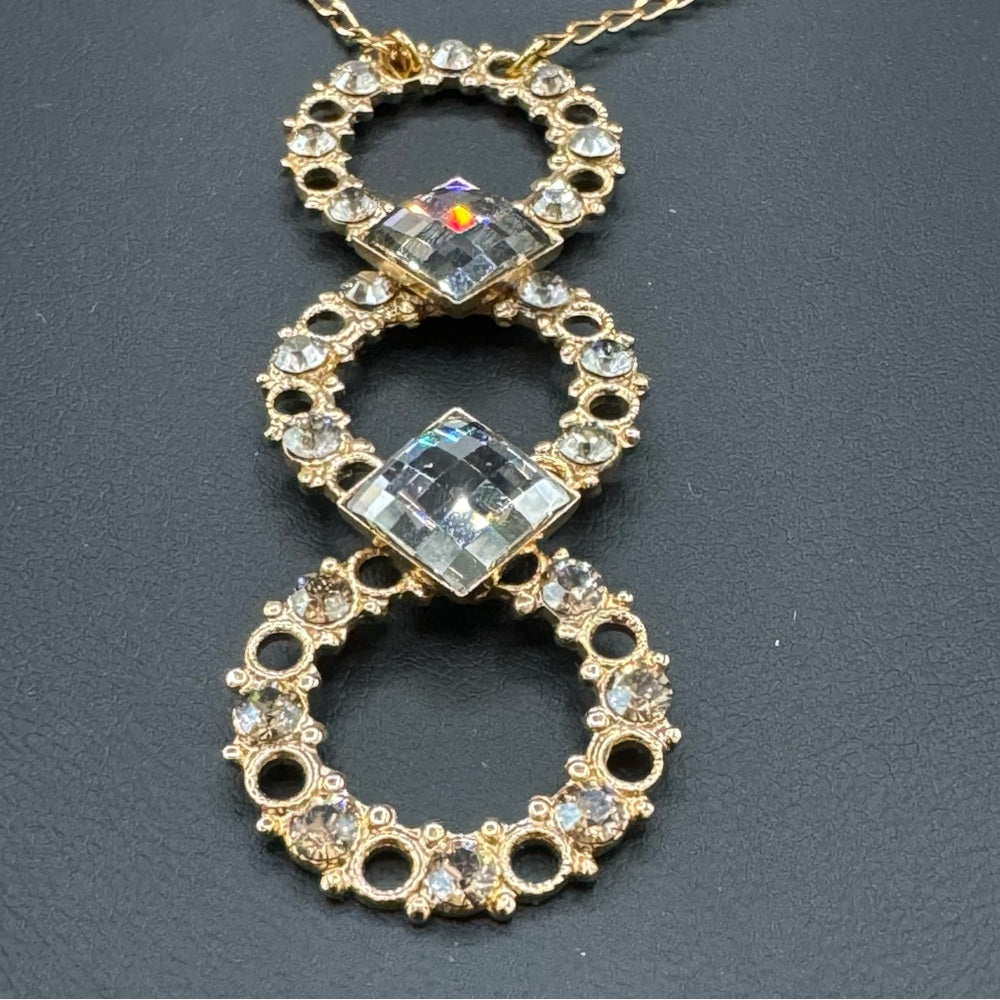Vintage Belladonna Circular Crystal and Gold Tone Infinity Pendant Necklace