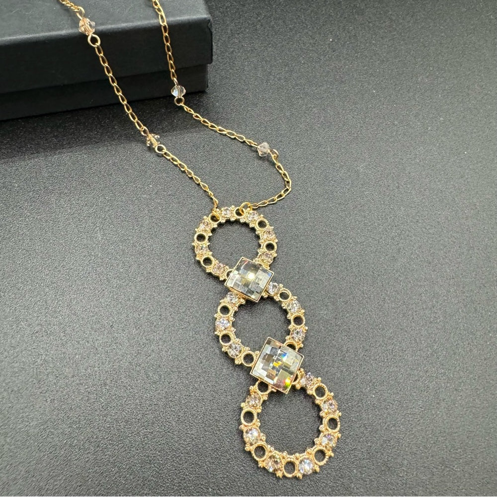 Vintage Belladonna Circular Crystal and Gold Tone Infinity Pendant Necklace