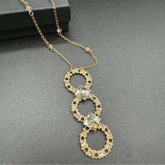 Vintage Belladonna Circular Crystal and Gold Tone Infinity Pendant Necklace