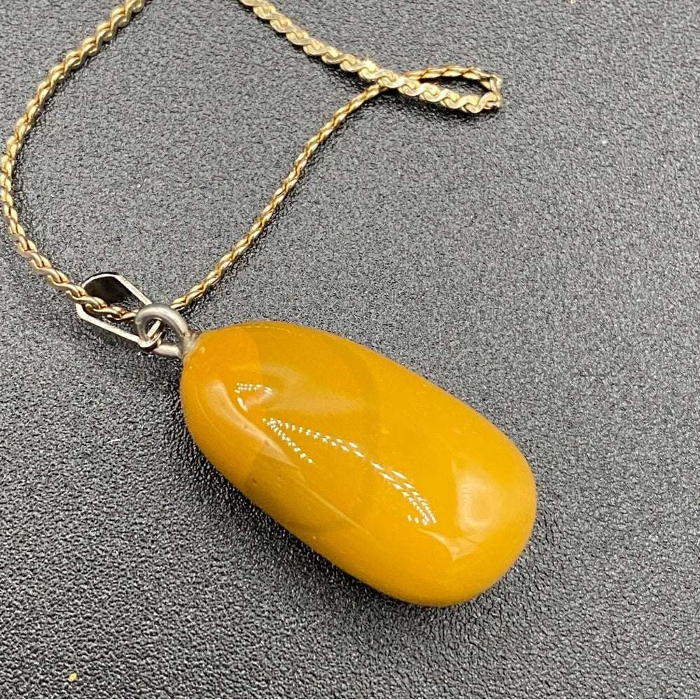 Amber Yellow Colored Pendant on Gold Tone Chain 23in